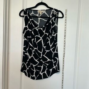 Michael Kors black and white print sleeveless blouse. Size L